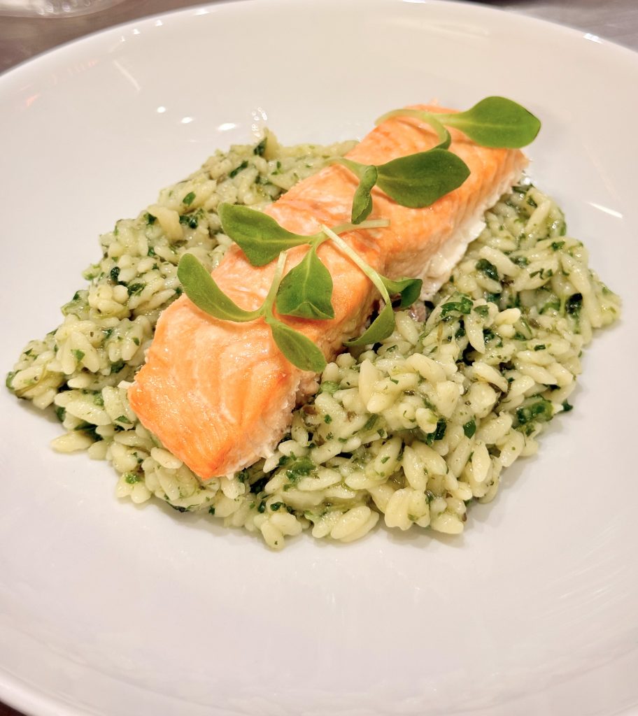 Salmon fillet on herb risotto prepared by Side Order Catering